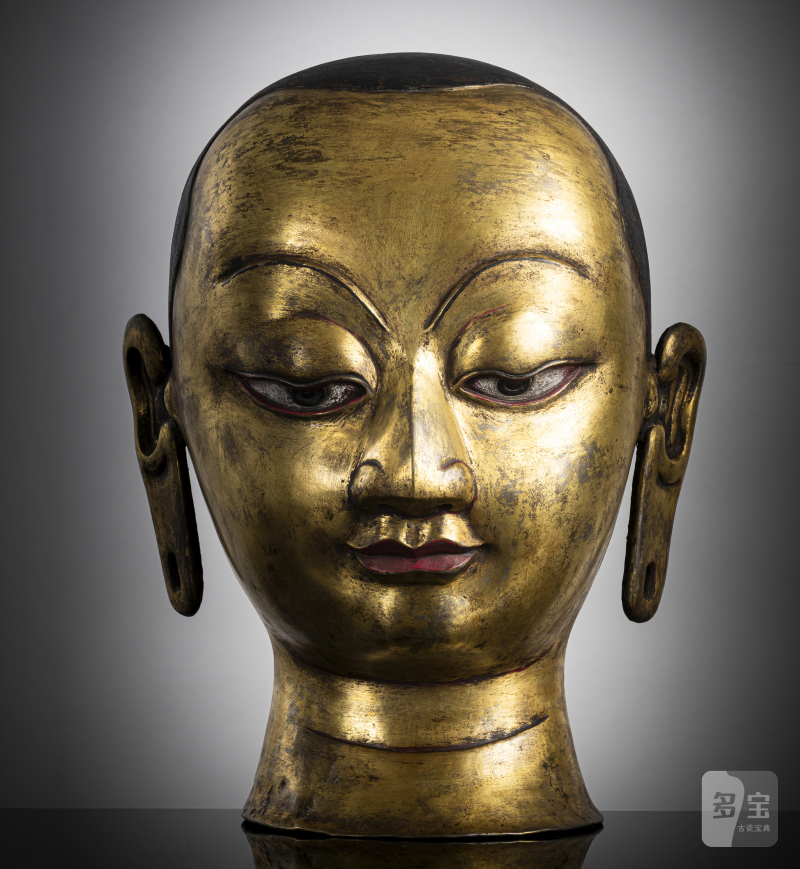 A RARE EMBOSSED COPPER RITUAL HEAD